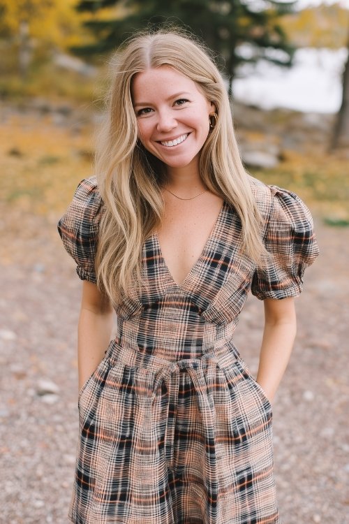 a woman wears a plaid short wedding guest dress in fall wedding