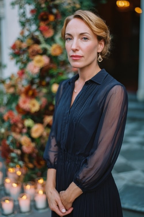 a woman over 50 in a teal chiffon cocktail dress with embroidered bodice