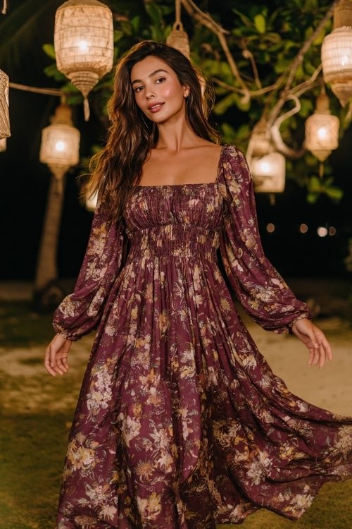 A woman in a plum floral-print chiffon dress with long sleeves and a square neckline