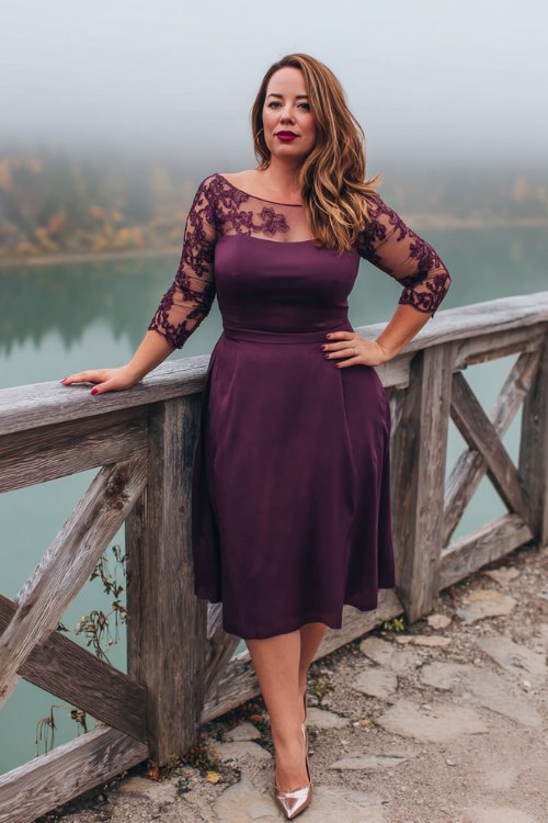 A plus-size woman over 40 wears a plum midi cocktail dress with lace