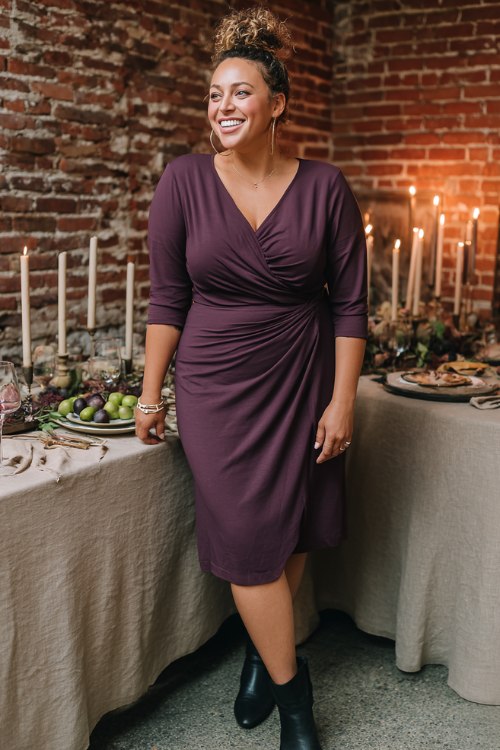A plus-size woman over 50 wears a plum jersey midi with a twist-front bodice