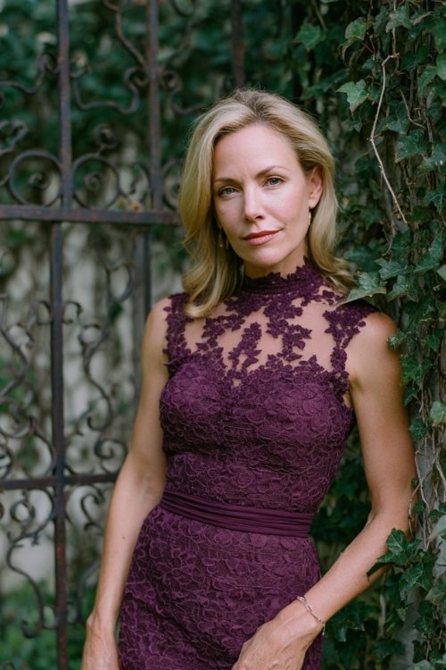 a woman over 50 in a plum lace sheath dress with scalloped hem and illusion neckline (2)