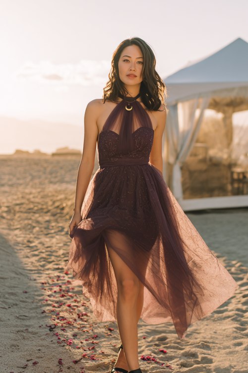 A petite woman wears an aubergine tulle midi with scattered embroidery and a soft capelet (2)